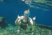 Girl Snorkeling around the sunken ship