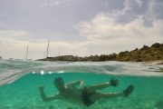 person snorkelling in turquise sea in zadar archipelago