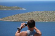 Guy taking photos with smartphone in Kornati islands
