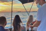 crew member serving wine on a zadar sunset private boat tour