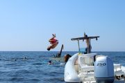 guy doing Somersault from speedboat