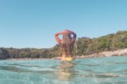 girl swimming in clear island bay
