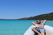 Guy relaxing on the speedboat