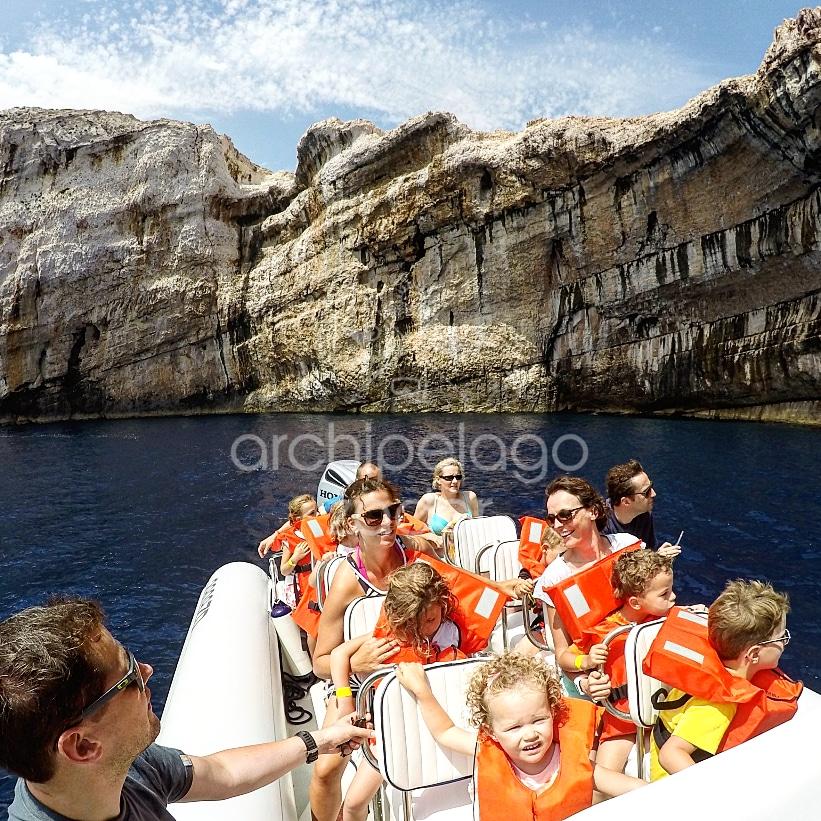 Family boat trip kornati islands cliffs