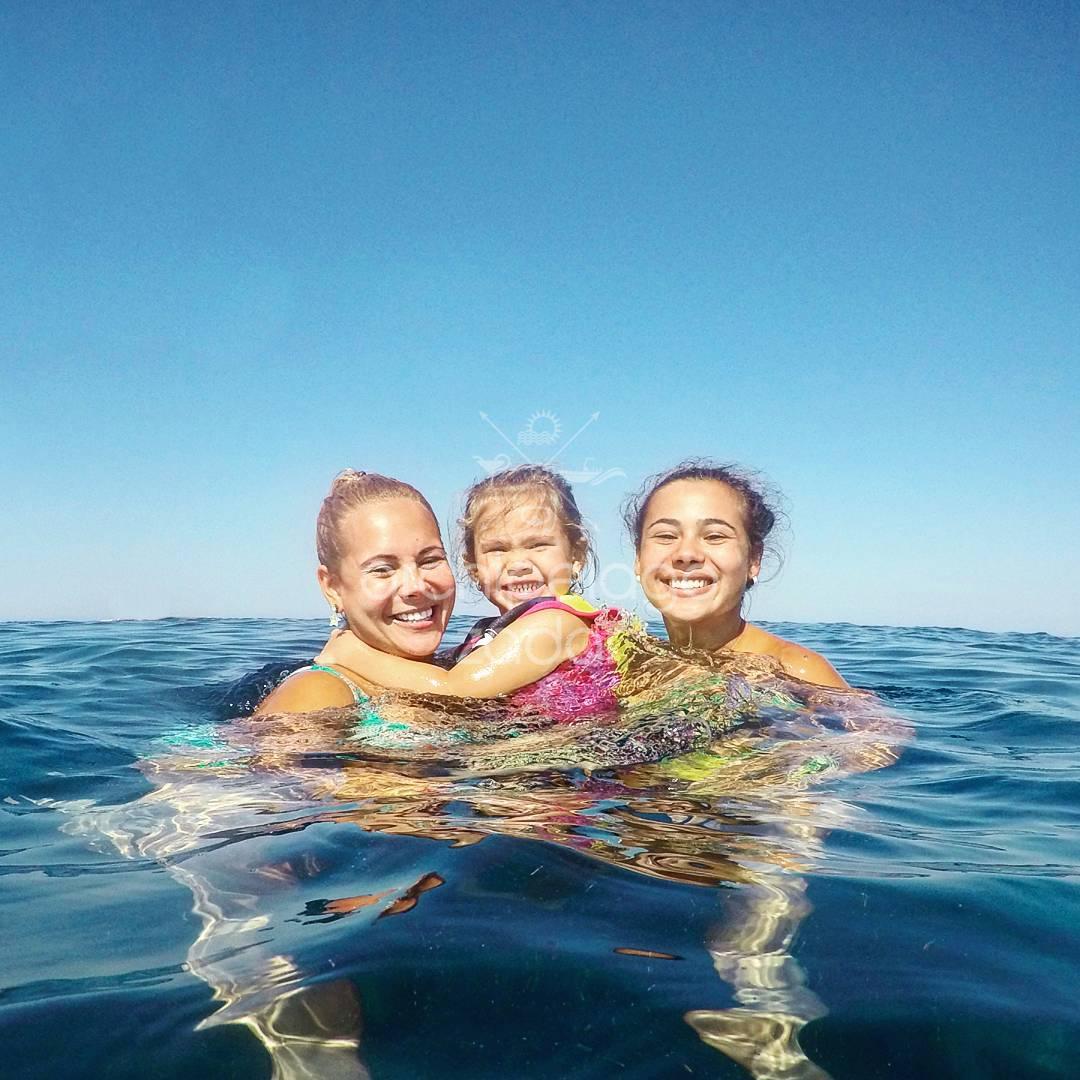 Family boat trip swim