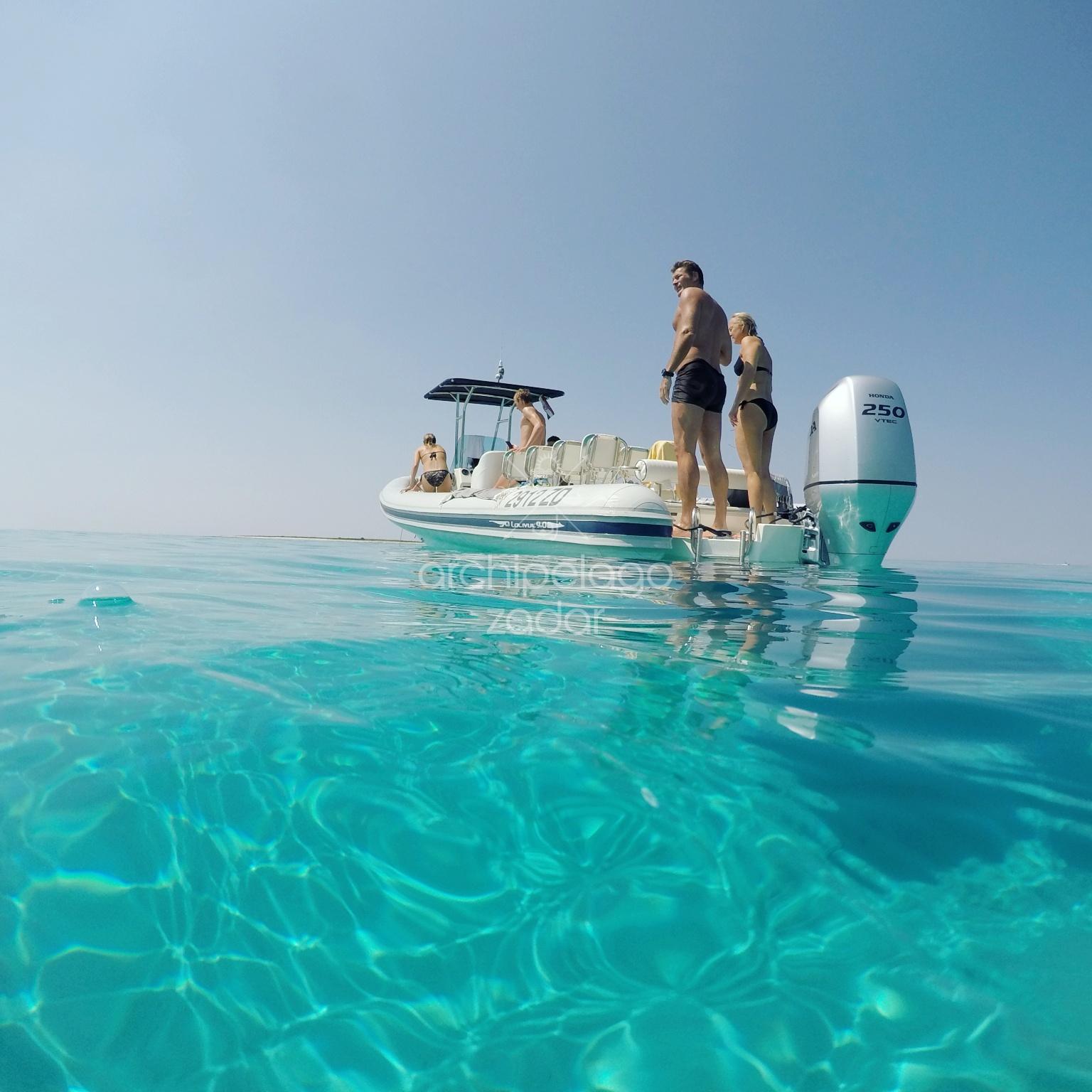 family on a boat in a private bay
