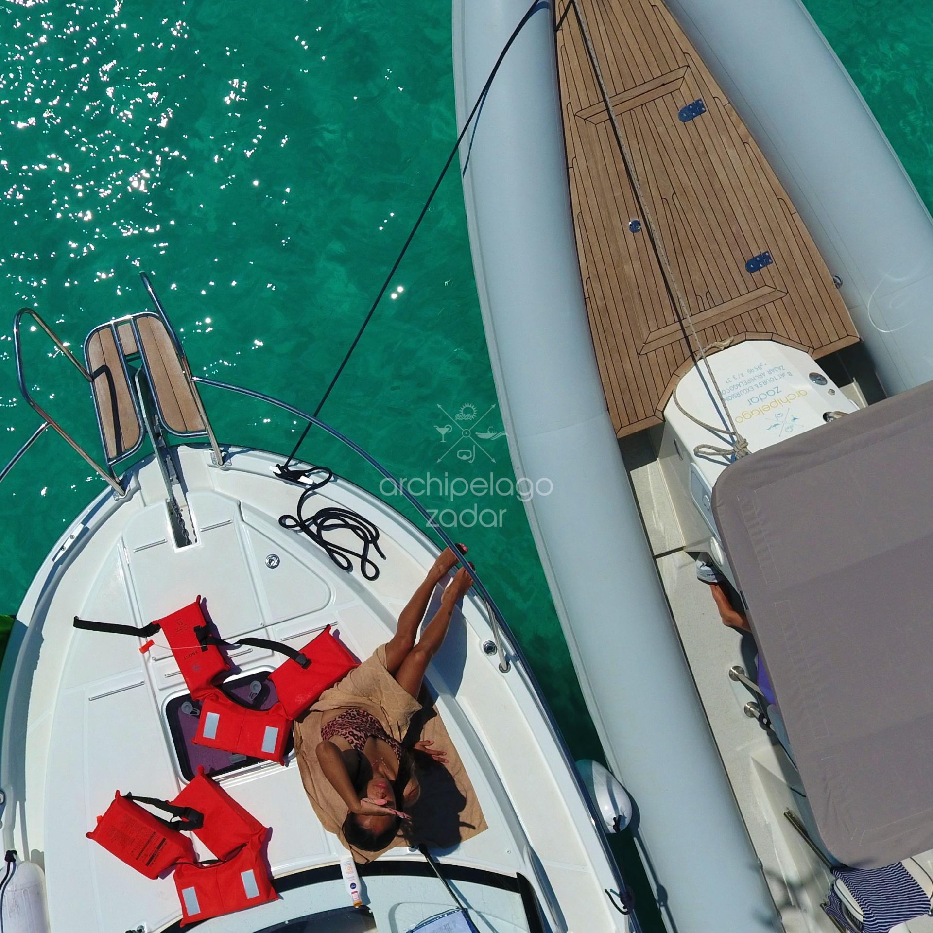 girl sunbathing on private biat