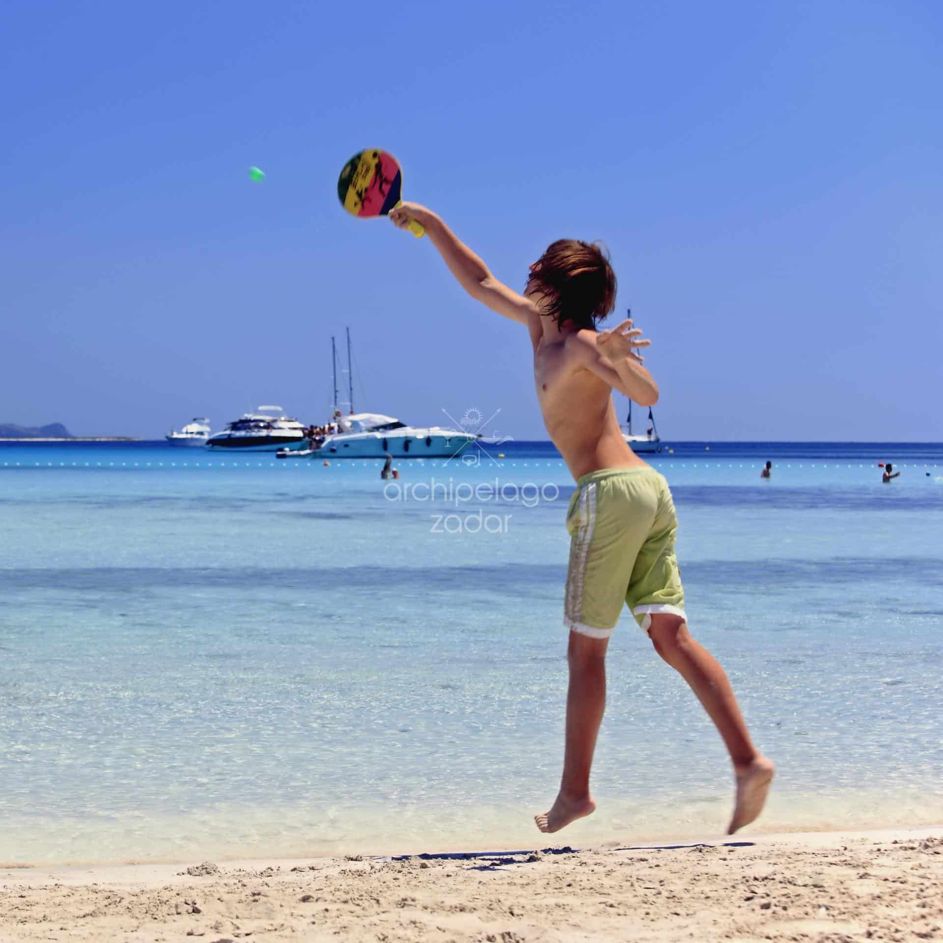 kid playing on sakarun beach