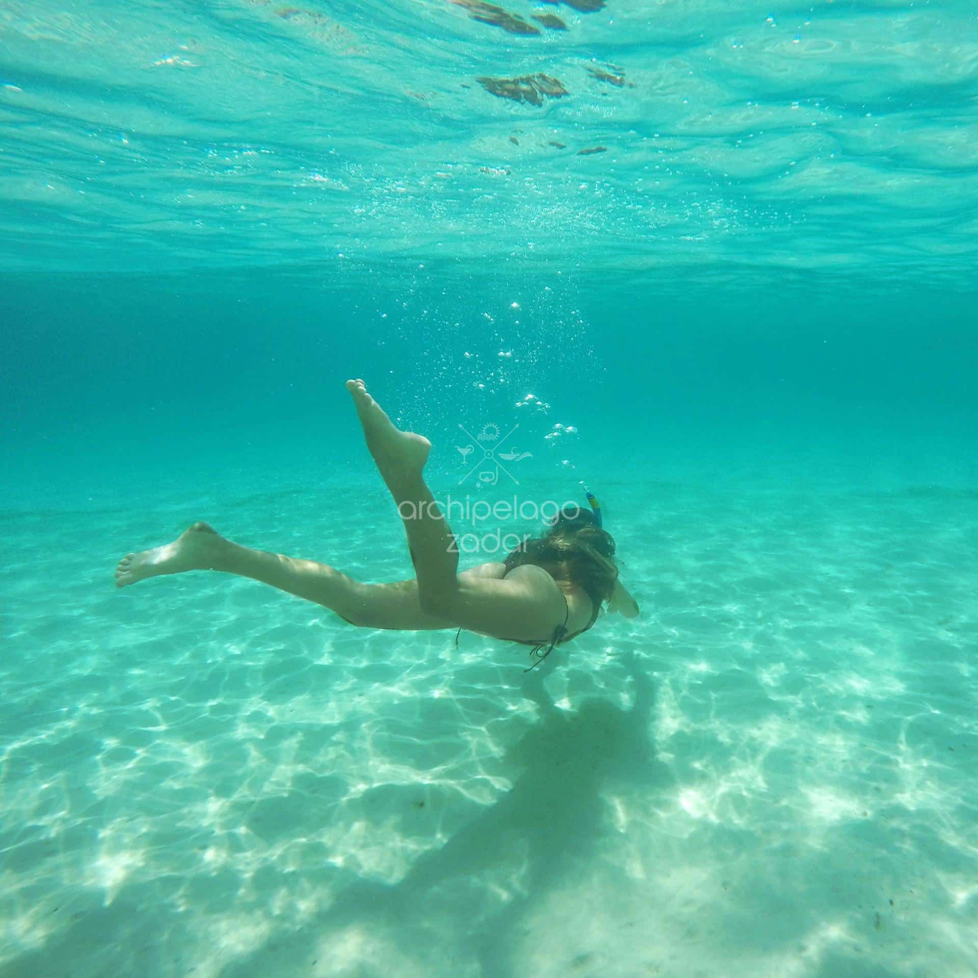 girl snorkeling