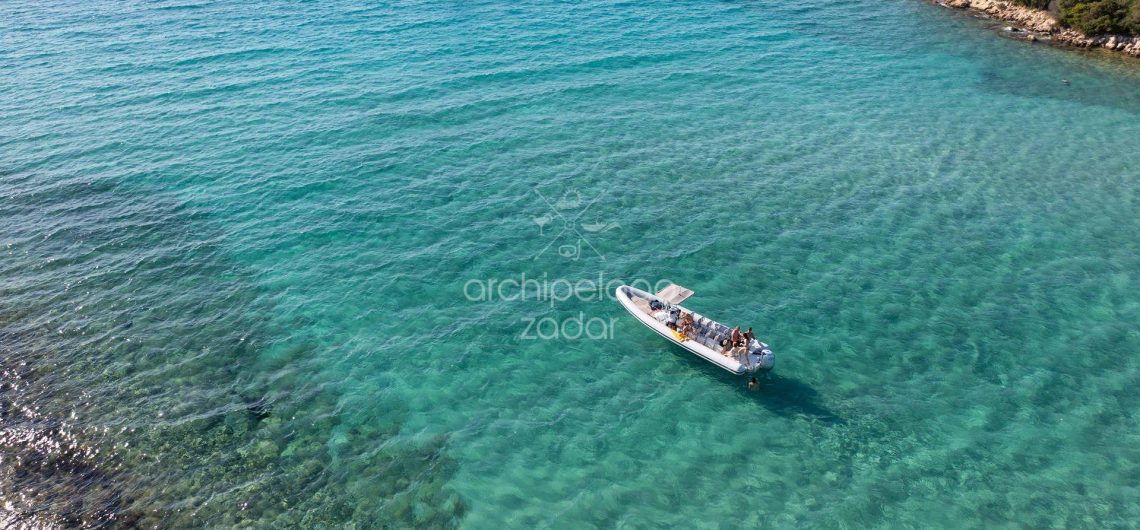 lolivul speedboat in a cove on a boat trip